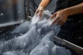 person washing a 3d printed garment, demonstrating its durability