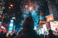 A person watching fireworks in a city.