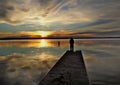 Person watching Sunset over Lake Seminole in Georgia Royalty Free Stock Photo