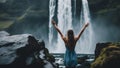 person in the water landscape photo of brave girl who proudly standing with his arms raised in front of water waterfall