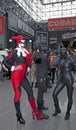 Person wearing Harley Quinn costume with others at NY Comic Con