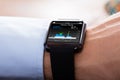 Person Wearing Smart Watch Showing Heartbeat Rate