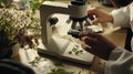 Ultra-realistic close-up of a botanist examining plant samples with a microscope in a research lab Royalty Free Stock Photo