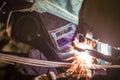 Man welding parts of a car