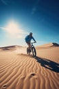 riding a bike on the desert dunes. extreme sports concept photography. Royalty Free Stock Photo