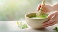 person whisking matcha tea in ceramic bowl with bamboo whisk. Generative AI Royalty Free Stock Photo