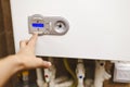 The person who regulates the heat in the central heating boiler Royalty Free Stock Photo