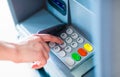 A person withdrawing money from a atm machine Royalty Free Stock Photo