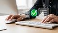 Person working on computer with digital verification and document management system Royalty Free Stock Photo
