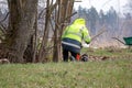 a person working in a garden in uniform Royalty Free Stock Photo