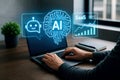 Person working on laptop with AI and Saa S data visualization on screen artificial intelligence chatbot Royalty Free Stock Photo