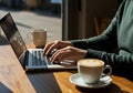 Person Working on Laptop in Cafe Royalty Free Stock Photo