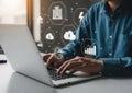Person working on laptop with cloud computing and data analysis icons Royalty Free Stock Photo