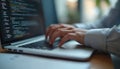 Person working on laptop. Hands typing on keyboard. Modern tech, digital tools. Code, software, programming, coding, developer. Royalty Free Stock Photo