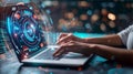 Person working on a laptop with a holographic interface and a blurred light background in view Royalty Free Stock Photo