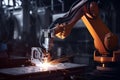 person, working with robotic arm and welding torch, repairing factory machine