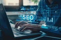 Person working on SEO strategy on a laptop, analyzing data and optimizing website performance in a professional setting