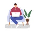 Person works and studies online, sitting in chair at home. Freelance worker at laptop computer in armchair. Man student