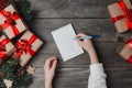 Person Writes In Notebook Christmas Gifts Around