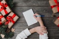 Person Writes In Notebook Christmas Gifts Around