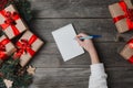 Person Writes In Notebook Christmas Gifts Around
