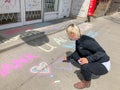 TORONTO, ONTARIO, CANADA - APRIL 28, 2020: PERSON WRITES POSITIVE MESSAGE IN CHALK ON SIDEWALK DURING COVID-19 PANDEMIC.