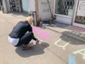 TORONTO, ONTARIO, CANADA - APRIL 28, 2020: PERSON WRITES POSITIVE MESSAGE IN CHALK ON SIDEWALK DURING COVID-19 PANDEMIC.