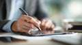 Person writing with a stylus on a tablet in a dedicated esignature zone showcasing seamless integration of digital tools Royalty Free Stock Photo