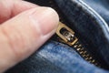 A person zipping up their jeans Royalty Free Stock Photo