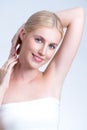 Personable woman showing her clean and smooth skin armpit in isolated background Royalty Free Stock Photo