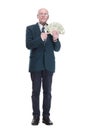 personable business man with a wad of dollar bills