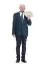 personable business man with a wad of dollar bills