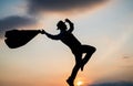 personal achievement goal. man silhouette jump on sky background. confident businessman running. daily motivation