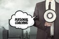 Personal coaching text on speech bubble with businessman