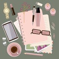 Personal diary on the table. Women`s glamorous things. Clock, lipstick, stationery, candles, smartphone. Stylish workplace