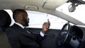 Personal driver waiting his boss, shopping reading news in social networks