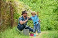 Personal example. Spring garden. Little helper in garden. Planting flowers. Growing plants. Take care of plants. Boy and Royalty Free Stock Photo