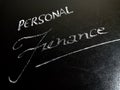 personal finance text displayed on chalkboard concept Royalty Free Stock Photo