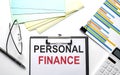 PERSONAL FINNCE text on paper sheet with chart,color paper and calculator Royalty Free Stock Photo