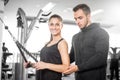 Personal fitness trainer with his client in gym. Royalty Free Stock Photo