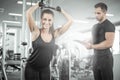 Personal fitness trainer with his client in gym. Royalty Free Stock Photo