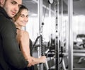 Personal fitness trainer with his client in gym. Royalty Free Stock Photo