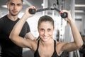 Personal fitness trainer with his client in gym. Royalty Free Stock Photo