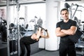 Personal fitness trainer with his client in gym. Royalty Free Stock Photo