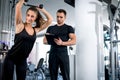 Personal fitness trainer with his client in gym. Royalty Free Stock Photo