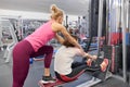 Personal fitness trainer working exercise with mature woman in the gym. Health fitness sport age concept Royalty Free Stock Photo