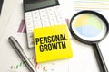 Personal growth on the yellow paper and pen on the graphs Royalty Free Stock Photo