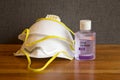 Personal hand sanitizer with pair of face masks reflect of fear of coronavirus and personal protection supplies Royalty Free Stock Photo