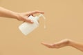 Personal Hygiene. Female Hands With Liquid Soap Against Beige Background. Daily Routine With Antibacterial Products Royalty Free Stock Photo