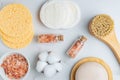 personal hygiene tools and cosmetics on white background. Face soap, brush with natural bristle. pink Himalayan salt in